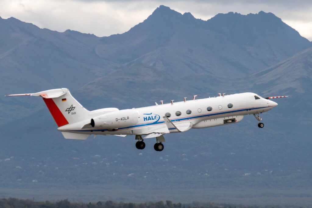 The HALO research aircraft taking off in Alaska for a measurement flight. The compartment located under the front part of the fuselage accommodates the infrared remote sensing device GLORIA (Gimballed Limb Observer for Radiance Imaging of the Atmosphere). (photo/©: Andreas Minikin / DLR)