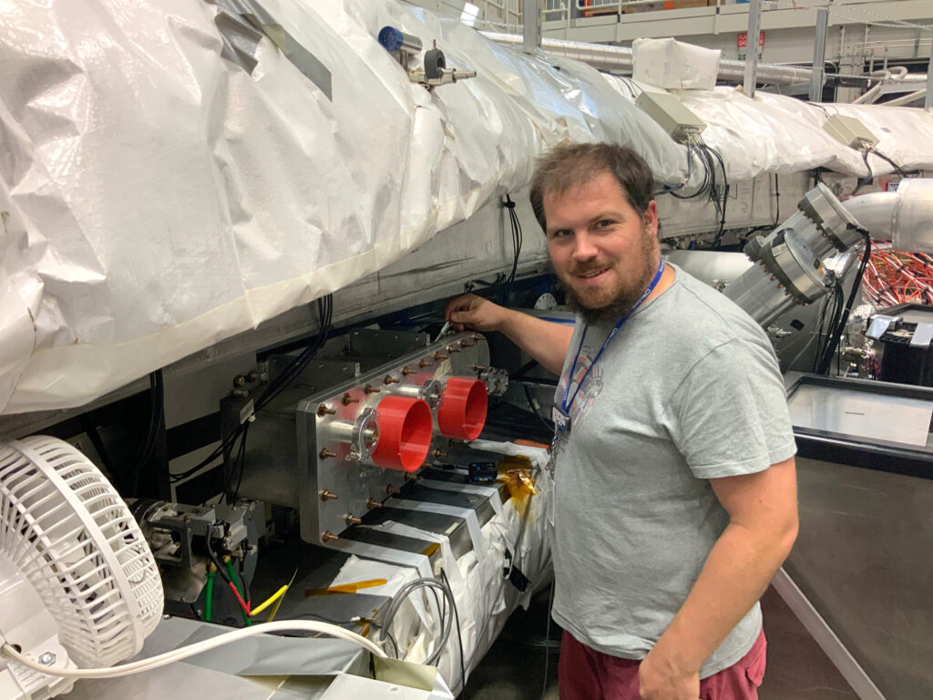 Dr. René Reimann working on the Muon g-2 storage ring (photo/©: private)